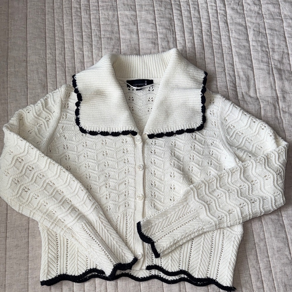 Elegant White Sweater with Black Trim